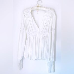 Free People white long sleeve top. Size Medium